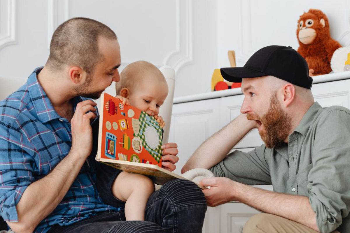 content-family-book A foster parent couple with a baby